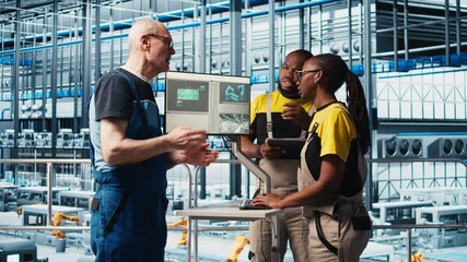 Poster - photovoltaics smart factory elderly team leader talks with workers diagnosing damaged iot sensors. i