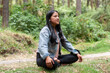 © Martin Stock Studio - Enjoying Peaceful Meditation in the Comfort of Nature Serene Woman in a Tranquil Forest Setting