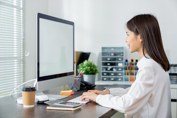 Aufkleber - Business woman hand using computer and type on the keyboard. Mockup screen of advertisement.