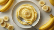 © D-stock photo - Plate with tasty mashed bananas on table, top view
