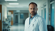 © li - Confident male doctor in white coat, embodying professionalism and trust in healthcare.