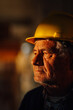 © Ljustina - Senior construction worker wearing hard hat looking away