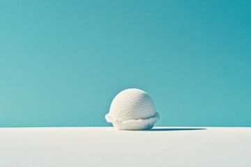Aufkleber - White ice cream scoop stands alone on a flat surface against a clear blue sky during a sunny day
