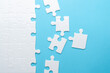 © AndS - Concept for problem-solving, teamwork, solutions, or missing connections. White jigsaw puzzle on a vibrant blue background with one missing piece. Minimalist composition with copy space.