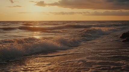Wall Mural - serene sunset over gentle waves on a tranquil beach shoreline