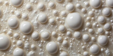 Aufkleber - close-up view of bubbles forming on a creamy surface in natural light during the morning hours