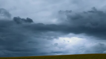 Poster - A large cloud in the sky. The sky is cloudy and dark. The clouds are very large
