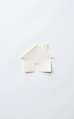 Poster - Paper House Cutout Sits On A White Paper Background With A Simple And Recognizable Design Cre