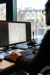 Wall Mural - person using a modern braille display device connected to a computer, analyzing tactile symbols on s