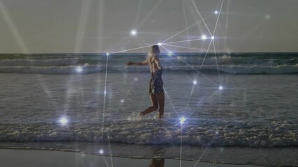 Poster - Walking on beach, woman surrounded by animation of glowing network connections