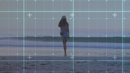 Poster - Walking on beach, woman interacting with digital grid animation overlay