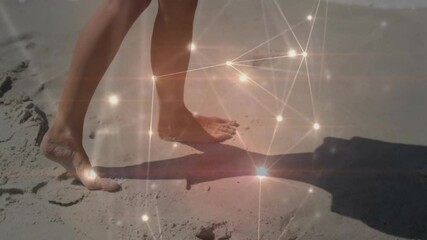Poster - Feet walking on sandy beach with glowing network animation overlay