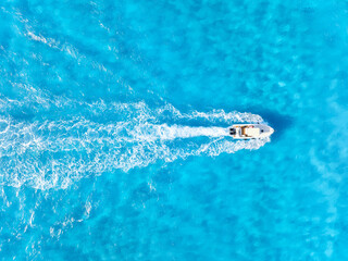 Wall Mural - seascape with motorboat. vacation and leisure. aerial view on fast boat on azure sea at sunny day. s