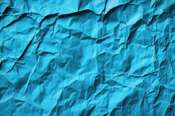 Poster - A textured, crumpled surface in vibrant blue, showcasing intricate folds and shadows that create a dynamic visual effect.