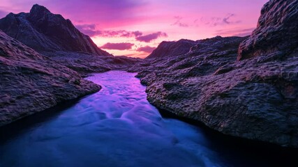 Wall Mural - Dramatic sunset over a flowing river in rocky terrain, purple and pink hues