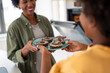 © Dorde - Cheerful African American Mother And Child Sharing Chocolate Cookies In Bright Modern Kitchen