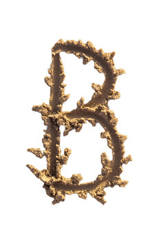 Alphabet (B) letters handwritten in sand on beach