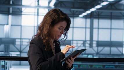 Poster - data center engineer stressed by cyberattack affecting devices, trying to protect critical systems. 