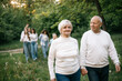 © Максим Галінский - 28.09.24 Vinnitsa, Ukraine: Grandparents with their children and grandchildren in front of them during a family photo shoot in the garden