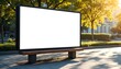 © KAMAPAN - Empty billboard in a sunny park setting.