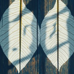 Poster - Two green leaves resting on a rustic wooden surface with natural textures and warm tones