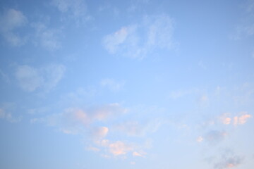 Wall Mural - beautiful blue sky and white fluffy group of clouds with sunrise in the morning, natural background