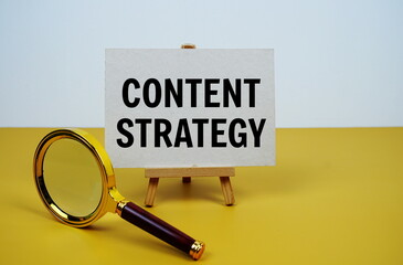 Aufkleber - Content strategy text on paper card with magnifying glass on yellow background