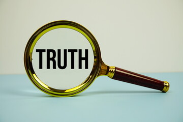 Aufkleber - Truth text with magnifying on blue background