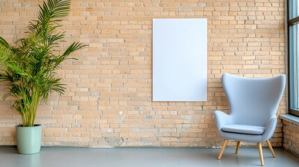 Poster - A stylish grey armchair sits near a blank poster on a warm exposed brick wall in a modern room.