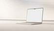 © Westend61 - 3D render of a cream-colored laptop with a blank screen on a carpeted surface