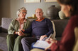 © Rido - Worried and sad senior couple having a consultation at home
