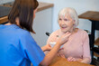 © zinkevych - Nurse feeding elderly patient soup at home during sickness