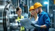 © AB Design - Engineers Reviewing Plans in Industrial Plant, Teamwork
