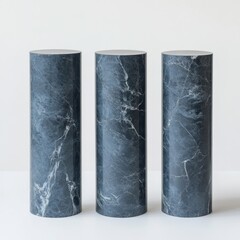 Poster - Three Marble Cylinders: A Minimalist Display of Stone Texture and Form against a Clean White Background.