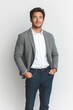 © letter - Casually Dressed Young Asian Man in Gray Blazer and Jeans Standing in Studio Setting