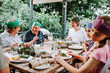 © Austockphoto - Happy multigeneration family enjoying Christmas dinner
