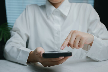 Poster - Person using smartphone in modern workspace, Business concept