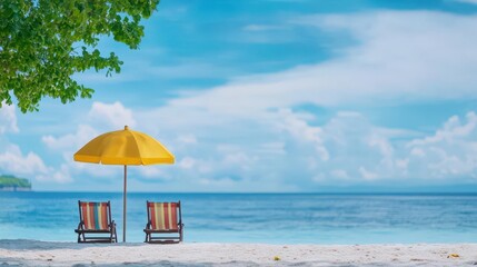 Poster - Two beach chairs and a colorful umbrella on a sandy beach with gentle ocean waves lapping at the shoreline