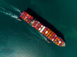 © SHUTTER DIN - shipping container carrier container sailing in green sea, global business and industry delivery service of cargo logistics to import export of international by ship freight transportation worldwide.