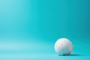 Poster - Creamy ice cream ball rests on vibrant blue surface, inviting taste and delight on a sunny day
