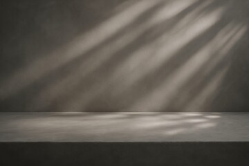 Poster - Empty table surface displaying shadows of plants on gray wall background, creating a minimalist and modern aesthetic, perfect for showcasing products or designs
