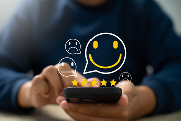 Wall Mural - customer satisfaction survey, customer using smartphones to rate their experience with five stars,on