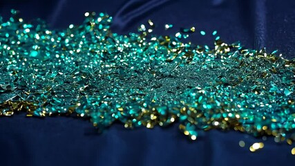 Poster - A pile of blue and gold glitter. The blue glitter is mostly on the left side of the pile