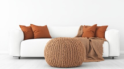 Poster - Large light-brown knitted ottoman in front of white sofa with burnt-orange throw pillows and matching blanket creating a cozy living room atmosphere