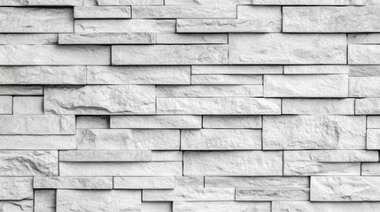 Poster - Close-up view of a textured wall featu rectangular light gray stone tiles arranged in a staggered pattern creating a modern architectural style.