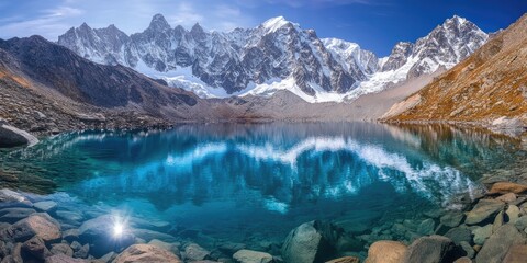 Wall Mural - lake surrounded by rocks and snow-covered mountains
