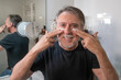 © quickshooting - An older man grooms himself and goes through his morning routine and undergoes men's beauty treatments.