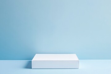 Fototapete - Blank white box on a light blue surface with minimalist background showcasing simplicity and elegance