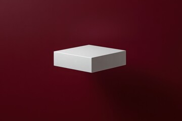 Aufkleber - Minimalist white cube floating against a rich burgundy background in a studio setting