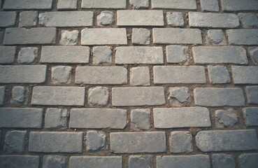 Poster - Close-up shot shows cobblestone sidewalk, old weathered surface. Grey, brown colors. Square paving stones brick texture, creating urban background. Grunge, vintage aesthetic, perfect for backgrounds.